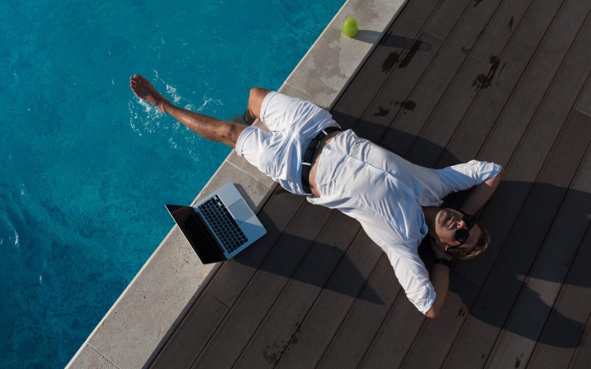 A modern senior man in casual clothes enjoys a vacation in an expensive house. Selective focus. High-quality photo